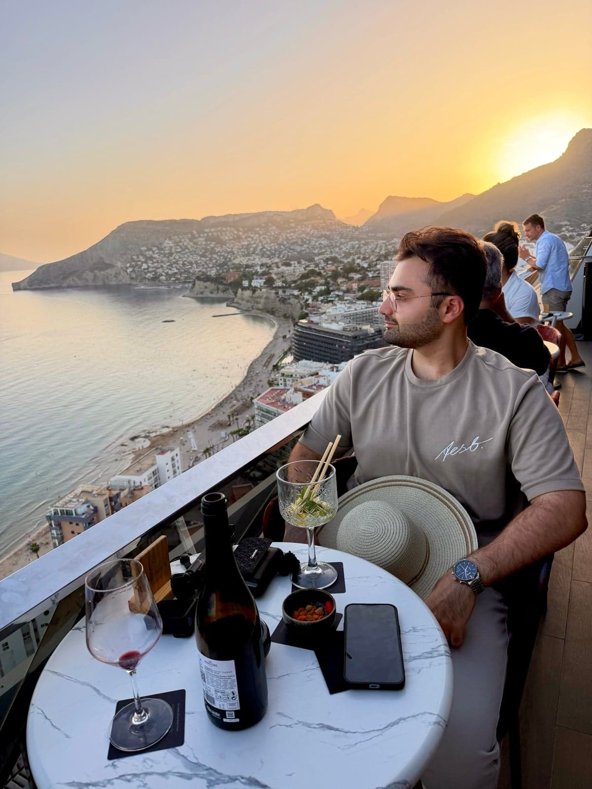 Watching the sunset over the coast from a terrace